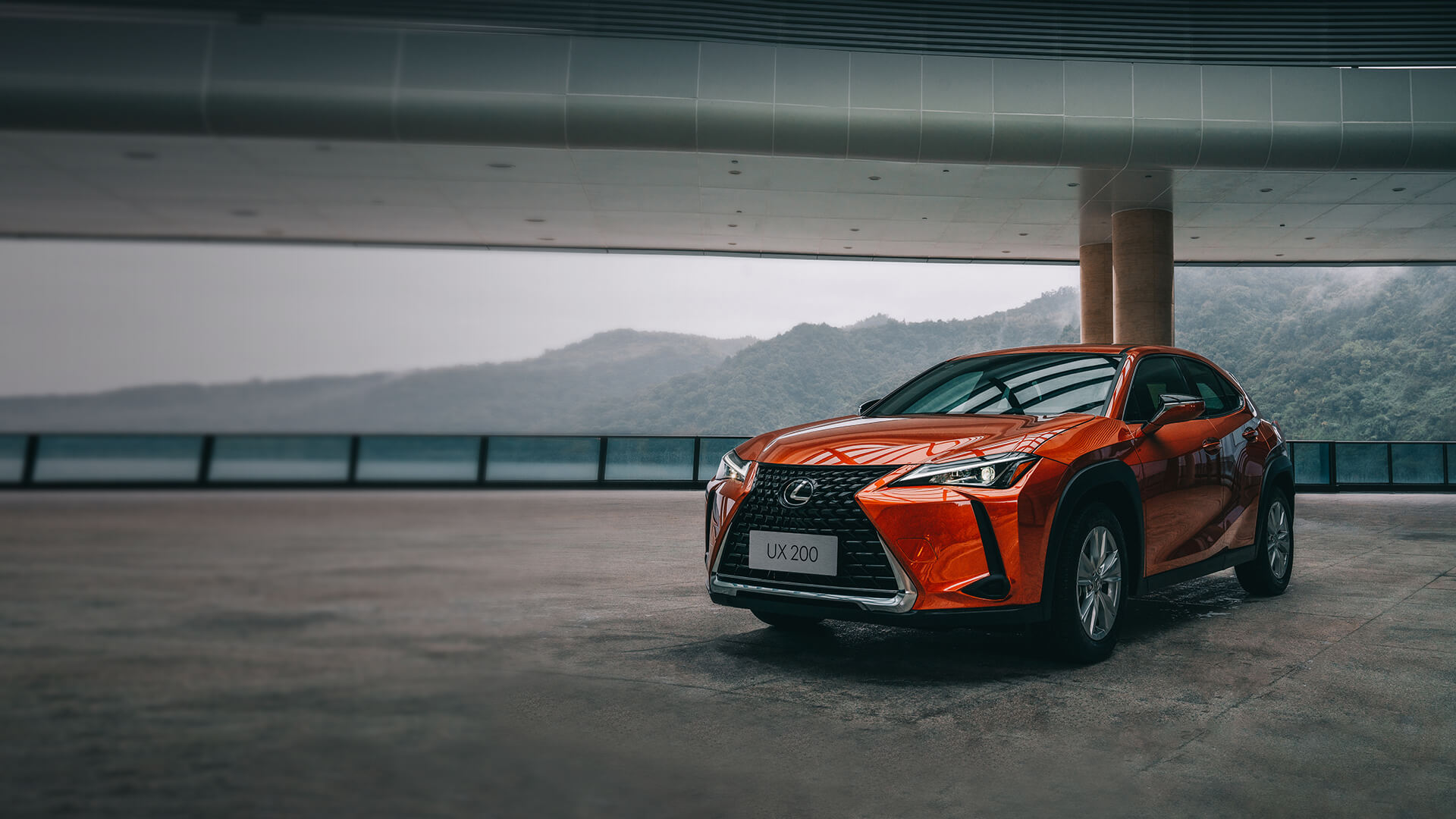 Orange Lexus UX parked in a building.