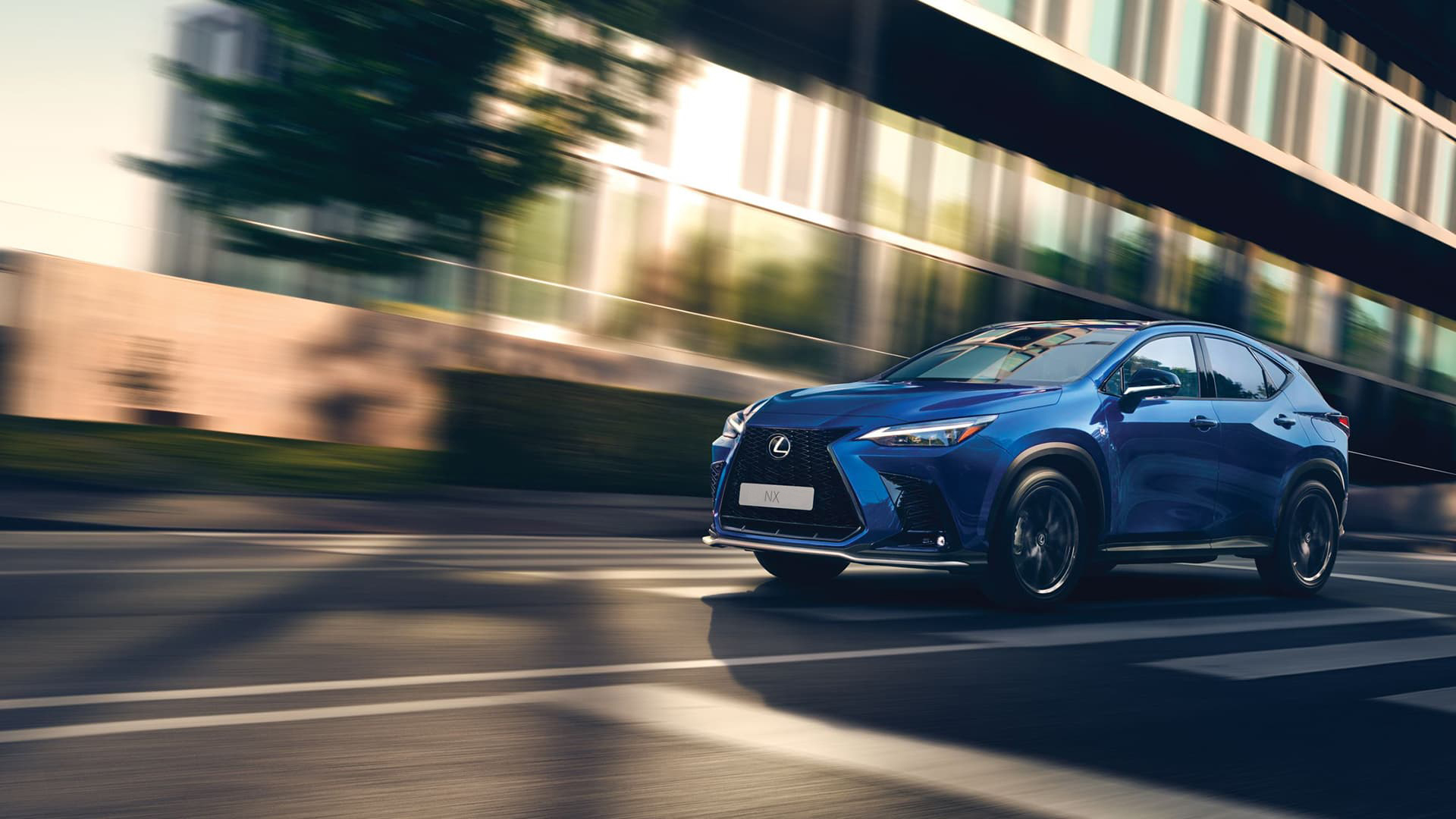 Blue NX being driven on the road.